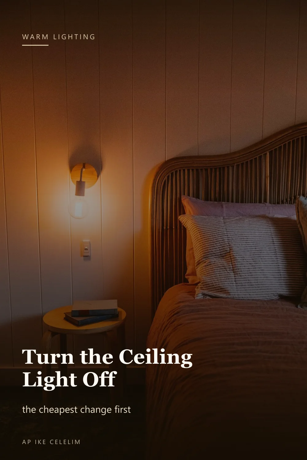 A softly lit bedroom with a warm bedside lamp and low evening light