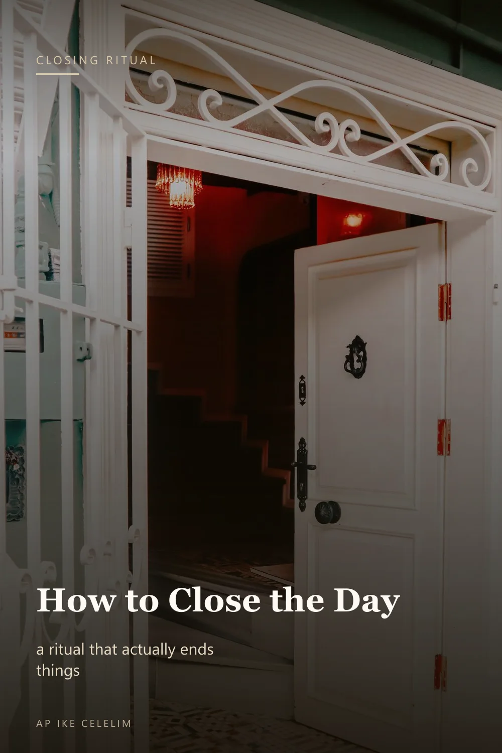 An open white front door revealing a dim hallway