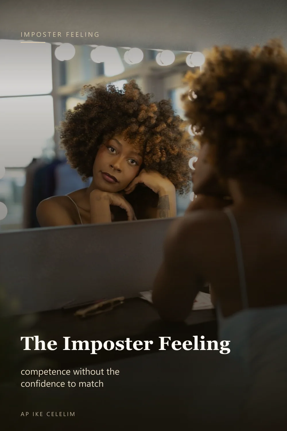 A woman gazing thoughtfully into a lit mirror
